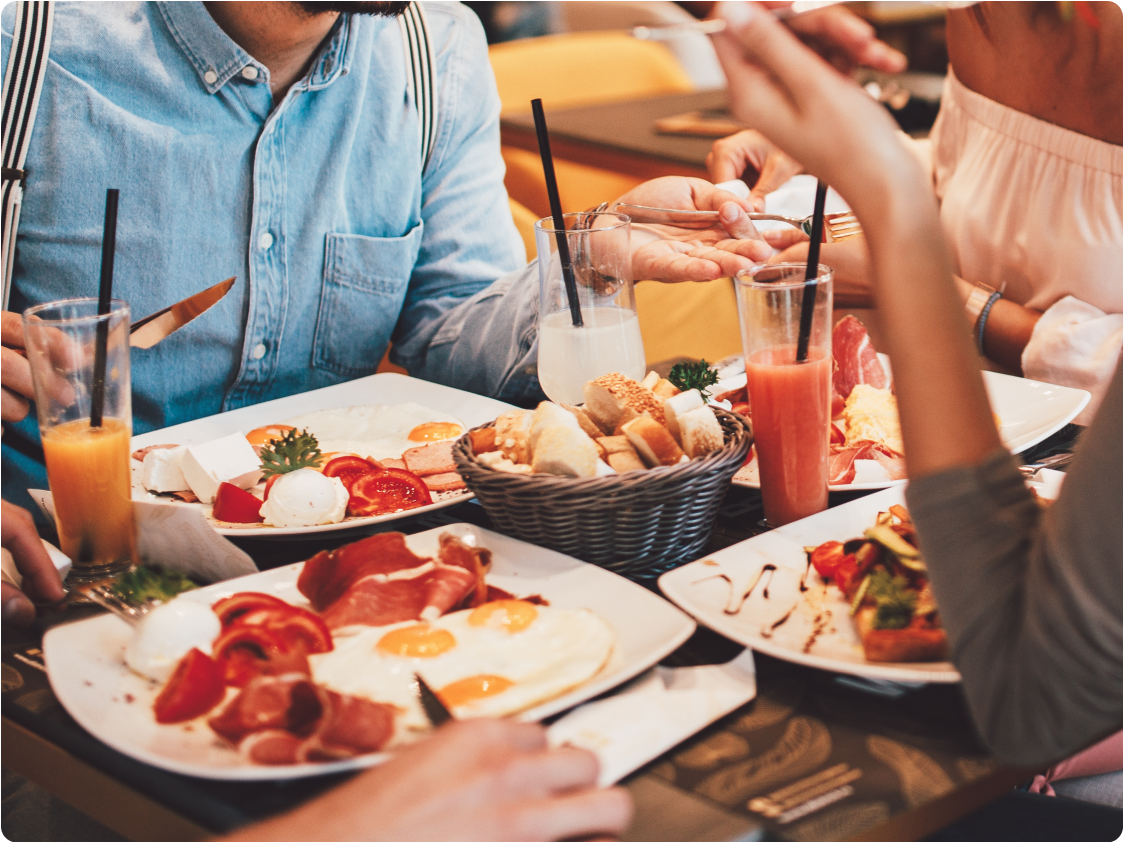 close of people eating a meal together