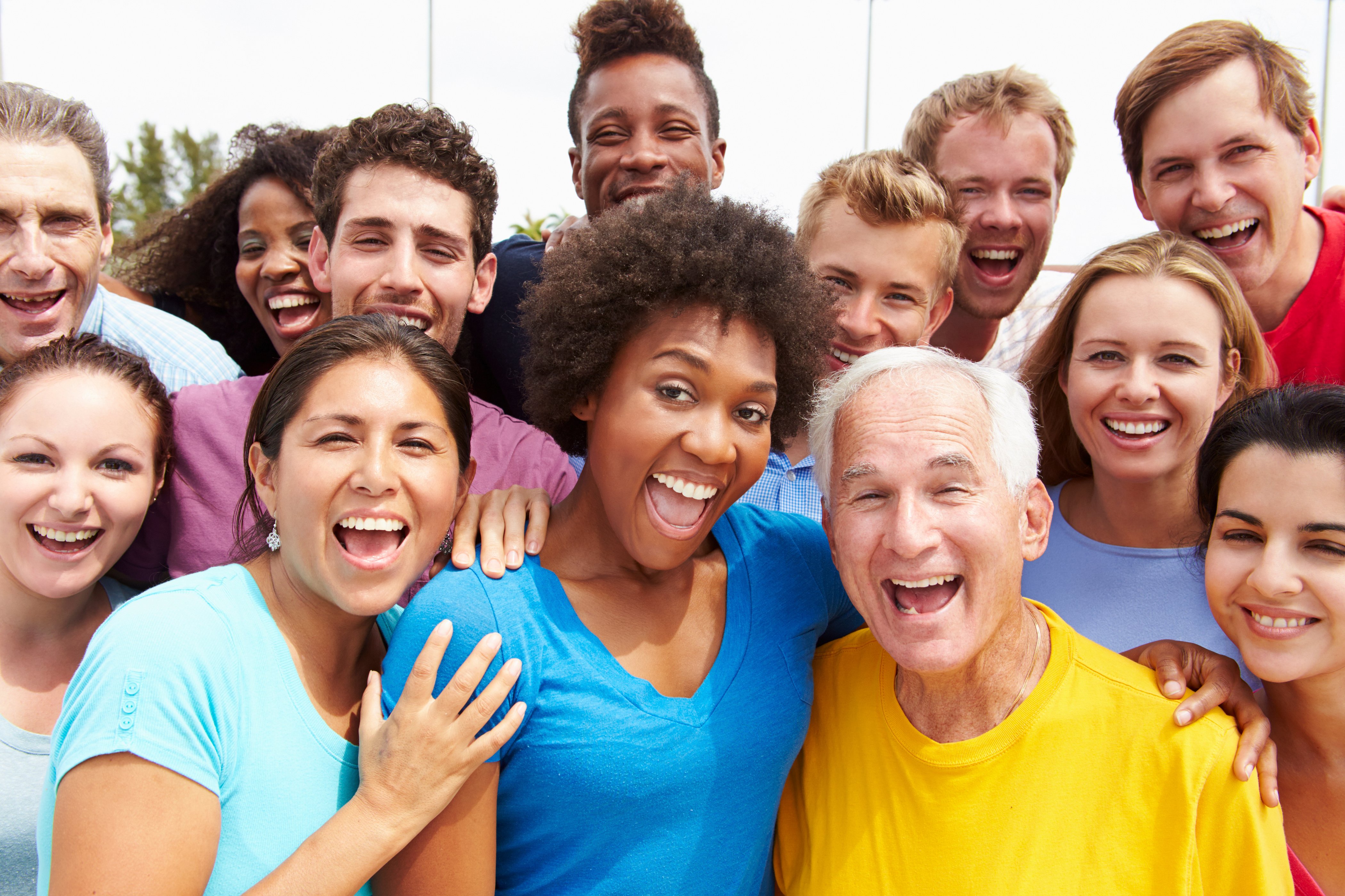 a group of happy individuals from different age and ethnic background