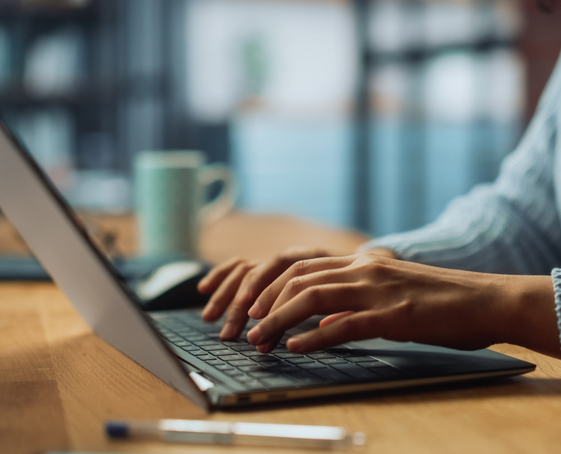 Person typing on laptop