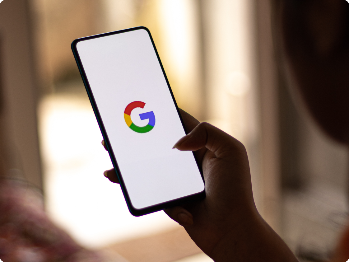 Person using Google Pay to pay for a coffee