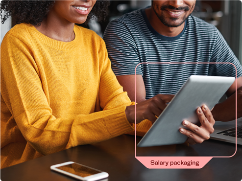 Couple using tablet to package salary